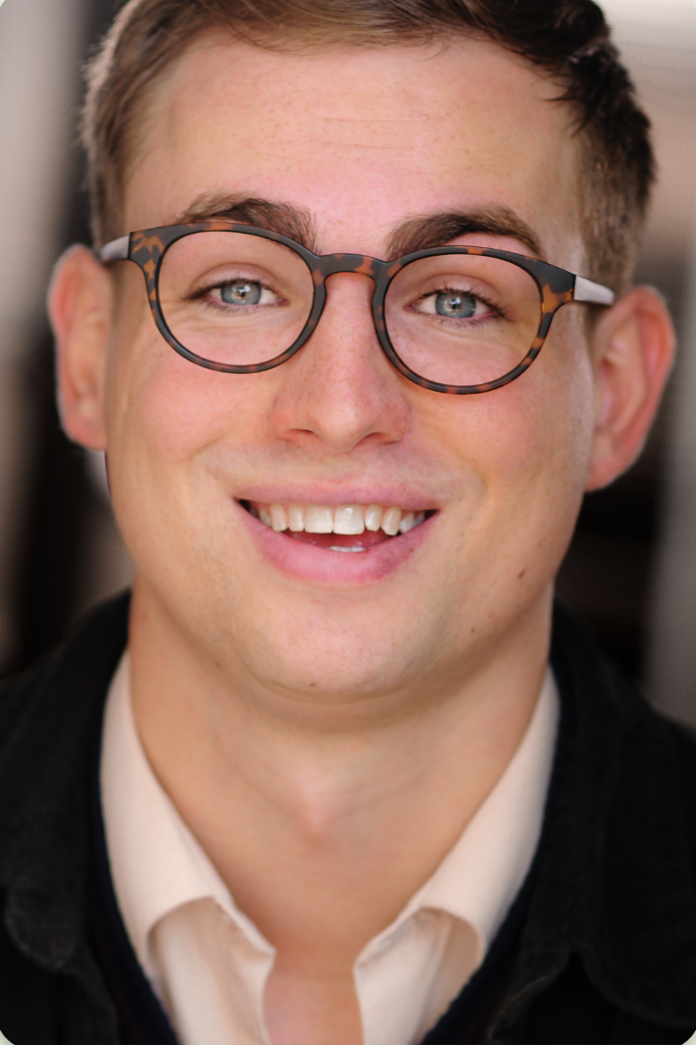 Will Warner smiling with glasses